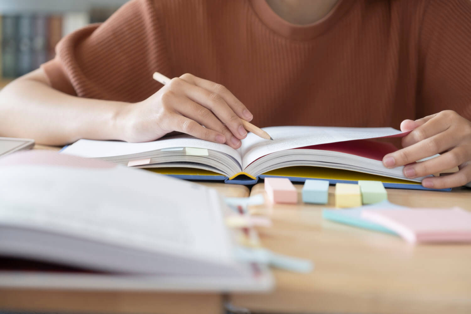 vecteezy_close-up-of-student-studying_1269525